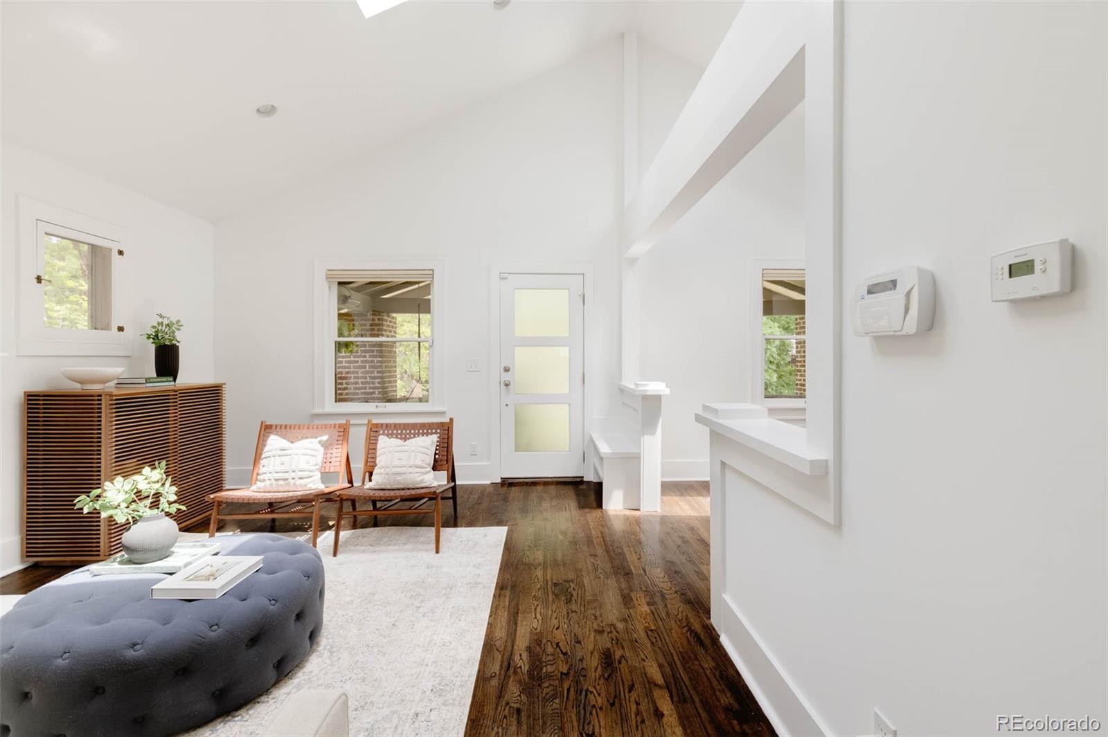 725 Monroe Street Denver, CO 80206 - Photo 5 of 33 a living room with furniture and wooden floor