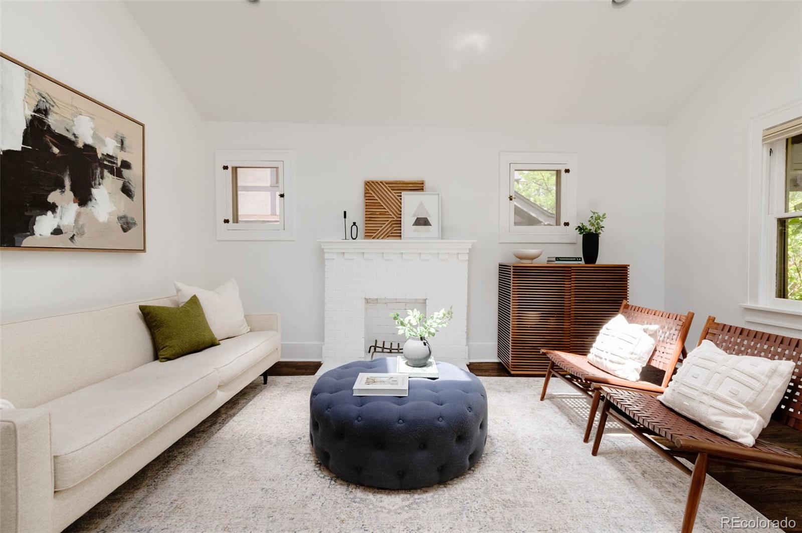 725 Monroe Street Denver, CO 80206 - Photo 6 of 33 a living room with furniture and a couch