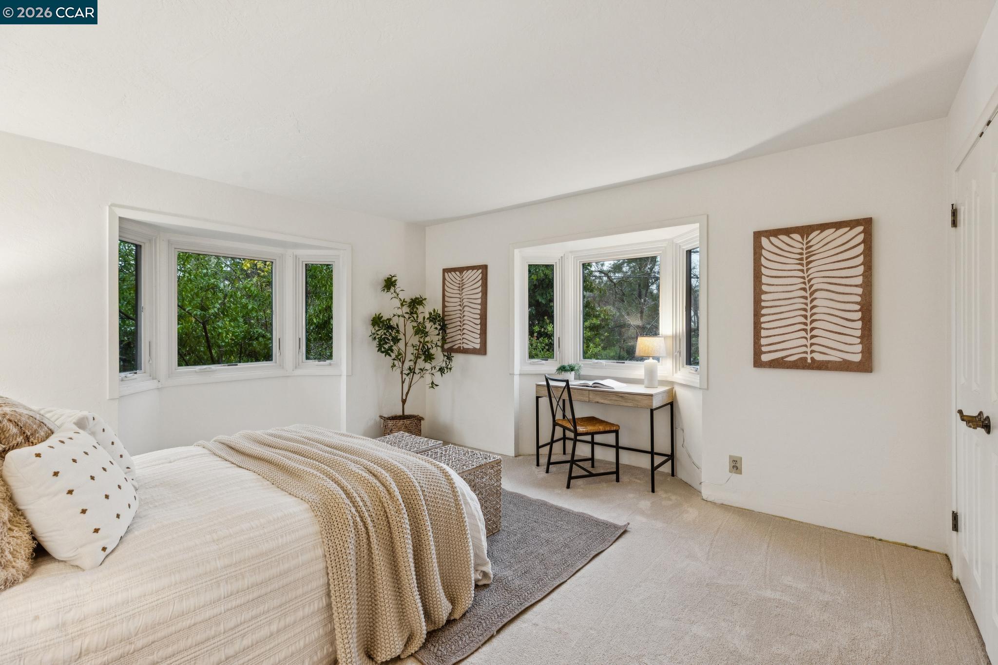 411 La Vista Road Walnut Creek, CA 94598 - Photo 23 of 57 a bedroom with a large bed and windows