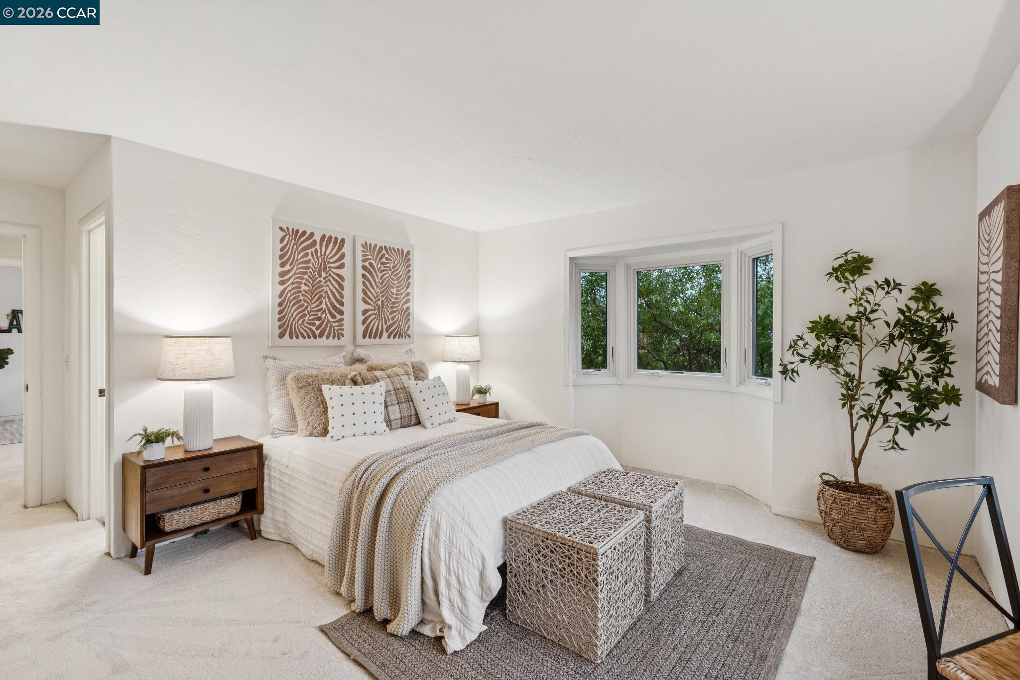 411 La Vista Road Walnut Creek, CA 94598 - Photo 24 of 57 a bedroom with a bed and a potted plant