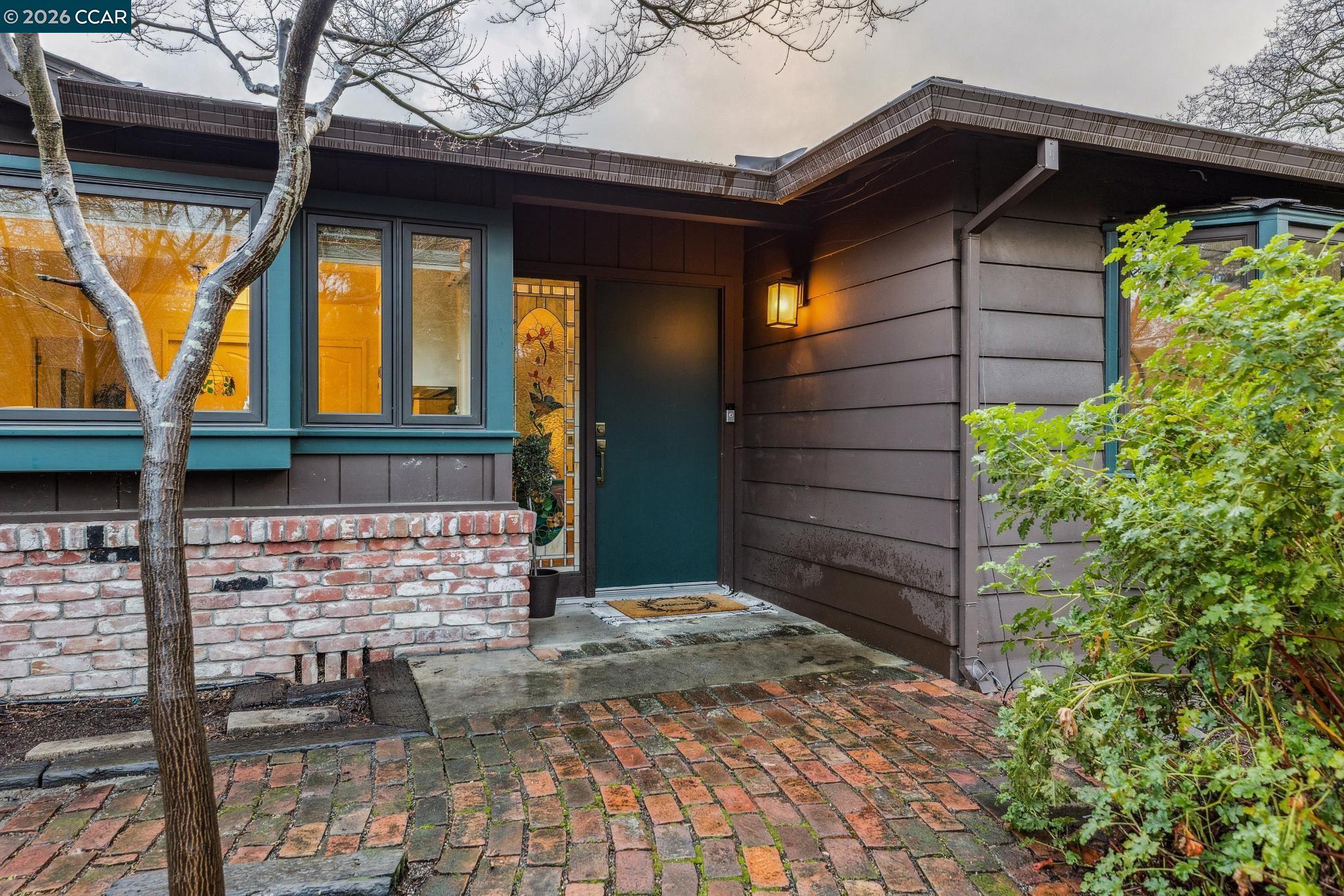 411 La Vista Road Walnut Creek, CA 94598 - Photo 3 of 57 a view of house with wooden door and glass door