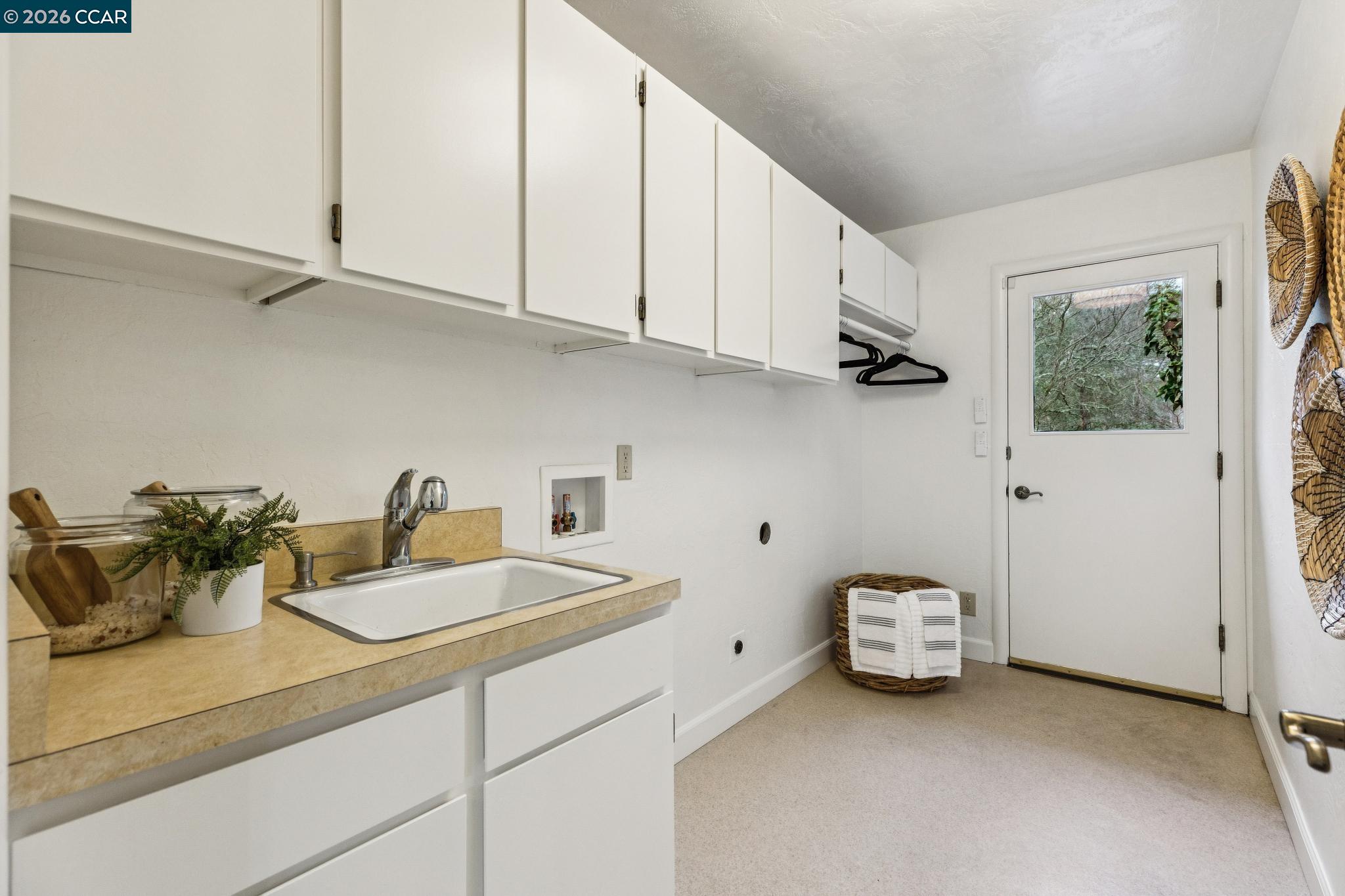 411 La Vista Road Walnut Creek, CA 94598 - Photo 33 of 57 a kitchen with a sink cabinets and appliances