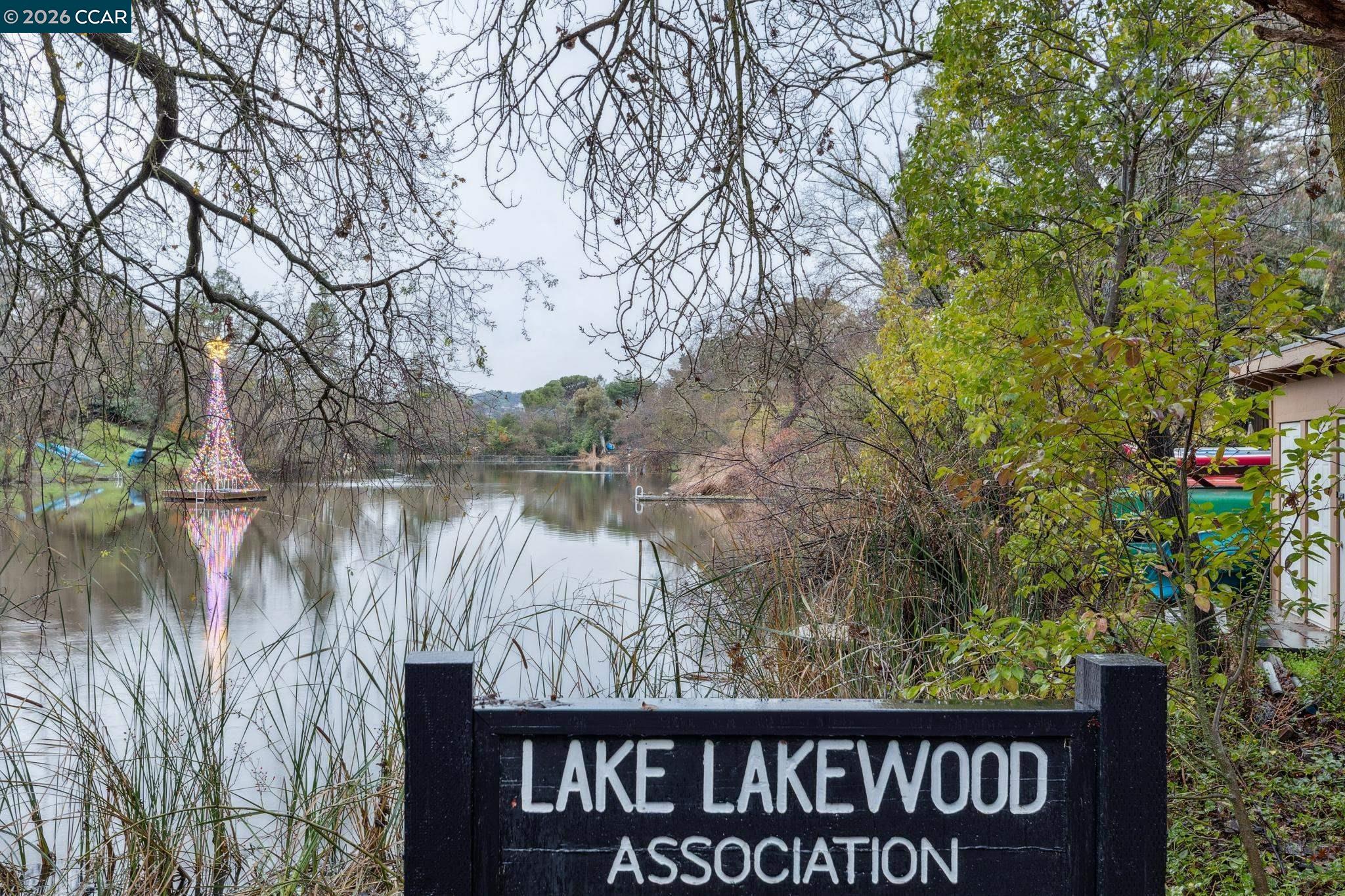 411 La Vista Road Walnut Creek, CA 94598 - Photo 45 of 57 a view of a wooden fence and a lake