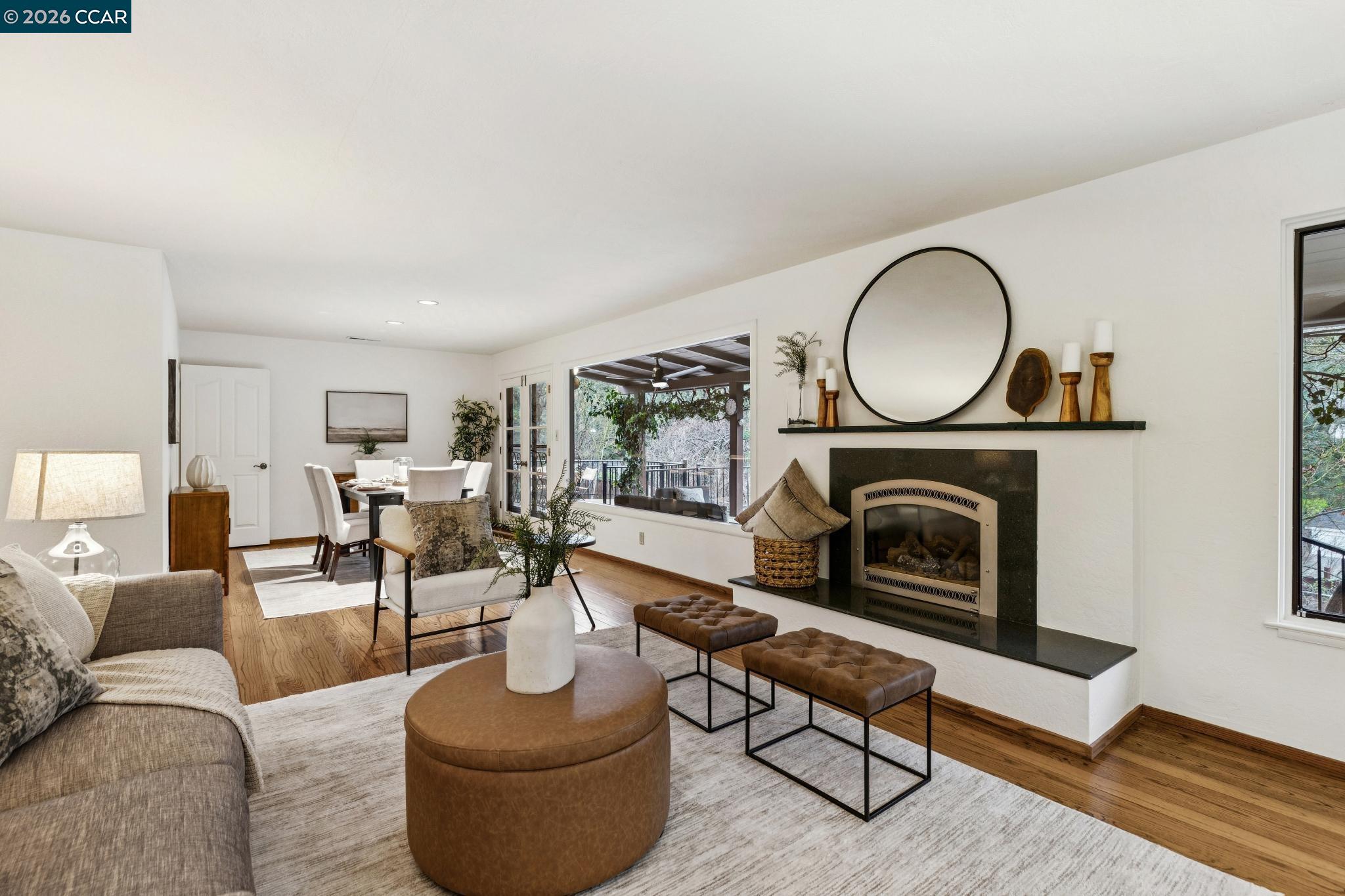 411 La Vista Road Walnut Creek, CA 94598 - Photo 9 of 57 a living room with furniture a fireplace and window