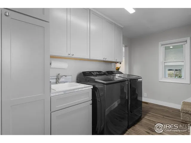 a utility room with closet dryer and washer