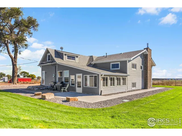 a view of an house with backyard porch and sitting area