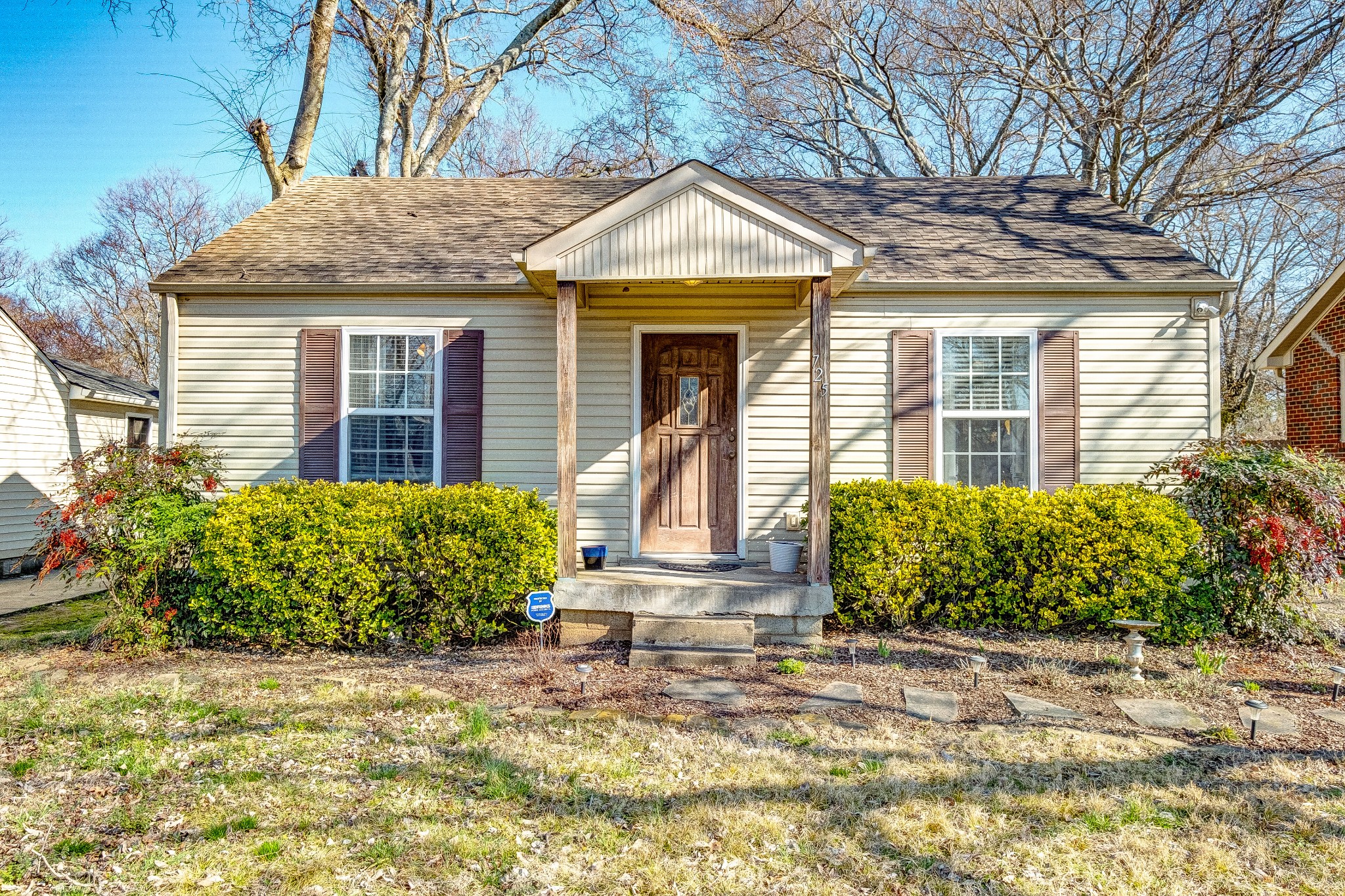 725 Neelys Bend Road Madison, TN 37115 - Photo 1 of 13 a front view of a house with garden