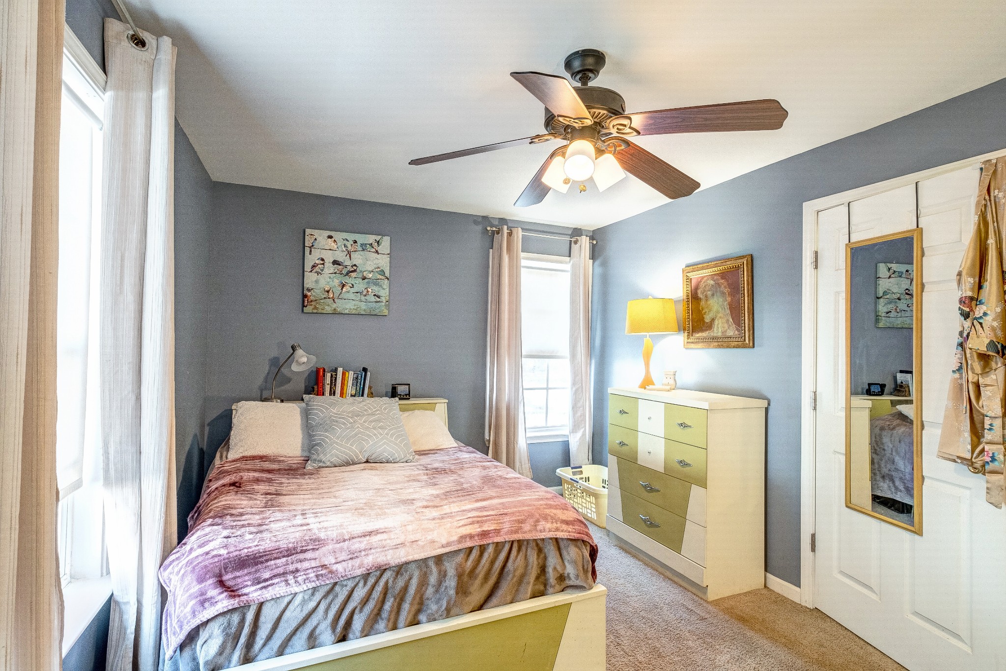 725 Neelys Bend Road Madison, TN 37115 - Photo 9 of 13 a bedroom with a bed and a chandelier