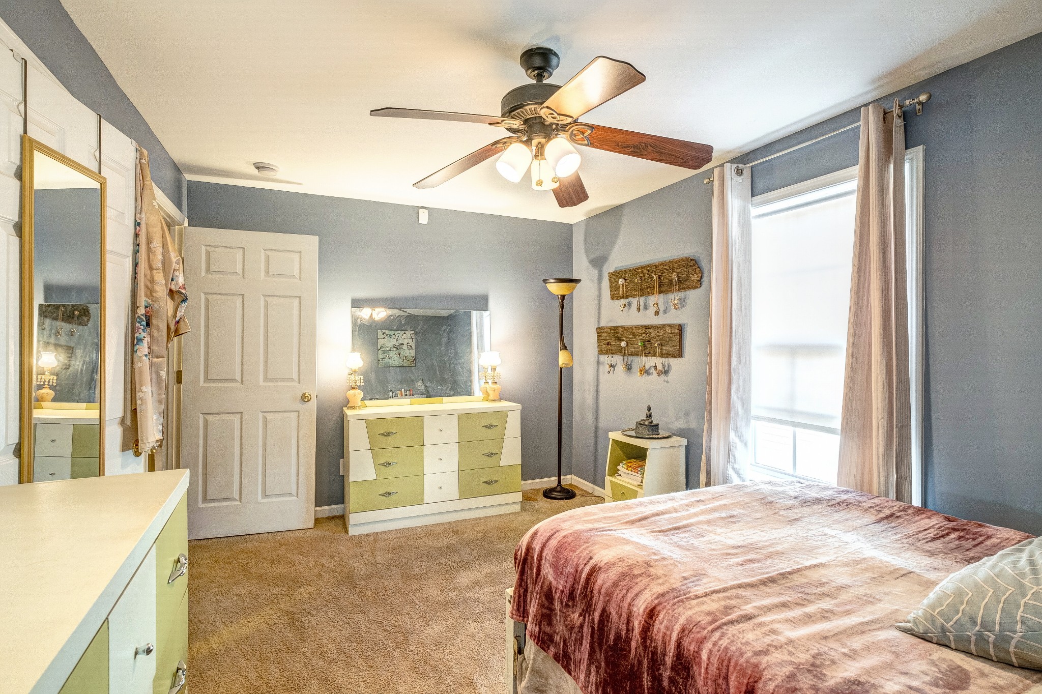 725 Neelys Bend Road Madison, TN 37115 - Photo 10 of 13 a bedroom with a large bed and a window