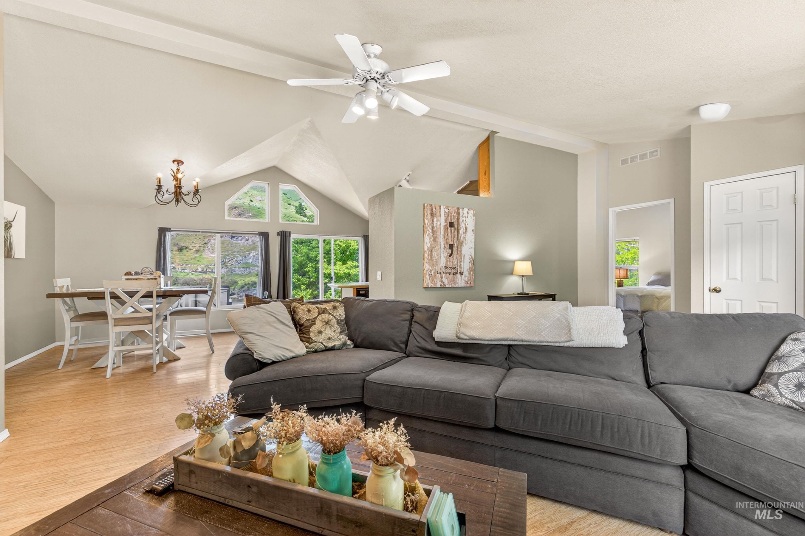 151 Cow Creek Road Lucile, ID 83542 - Photo 11 of 50 Vaulted ceilings featuring exposed beams and a ceiling fan