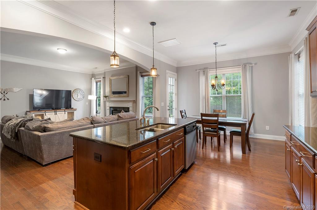 2011 Fallondale Road Waxhaw, NC 28173 - Photo 11 of 39 a kitchen with granite countertop a sink a counter top space and living room view