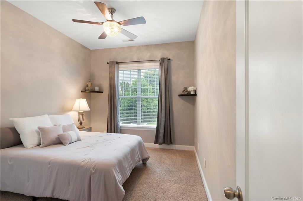 2011 Fallondale Road Waxhaw, NC 28173 - Photo 20 of 39 a bedroom with a bed and a window