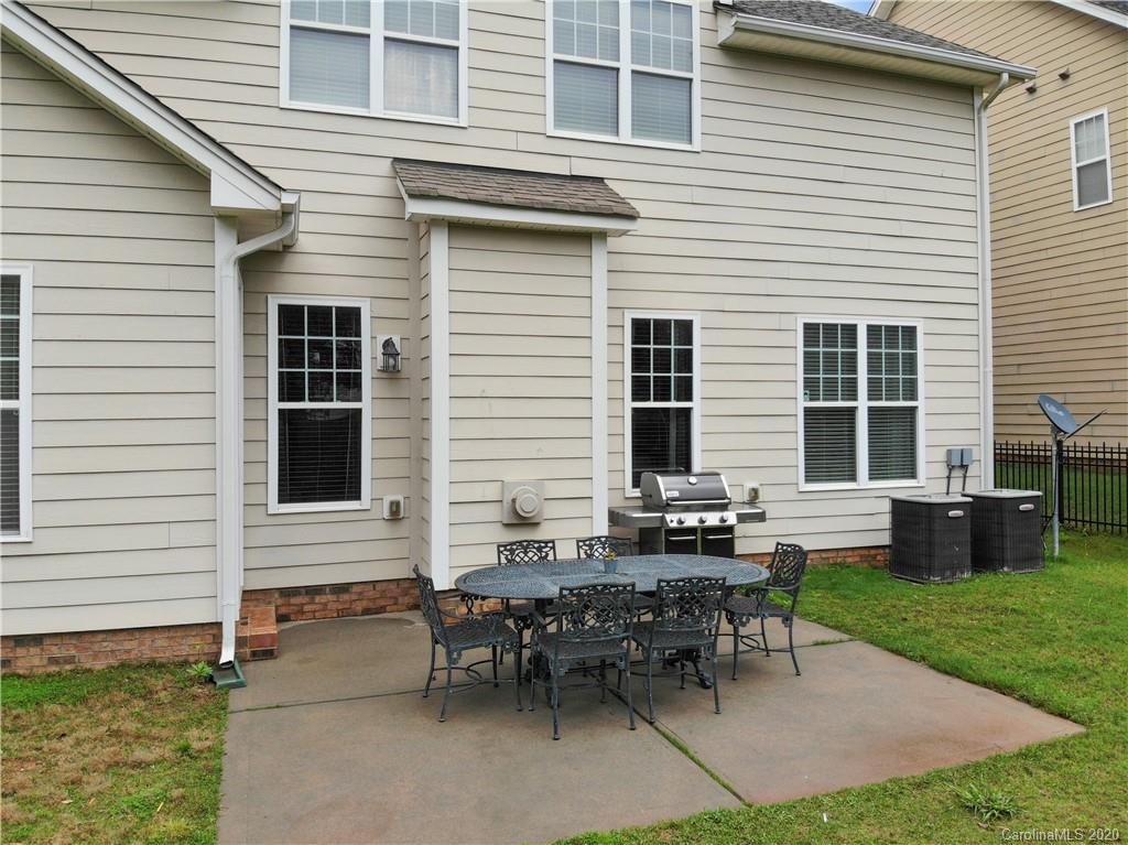 2011 Fallondale Road Waxhaw, NC 28173 - Photo 34 of 39 a backyard of a house with outdoor seating