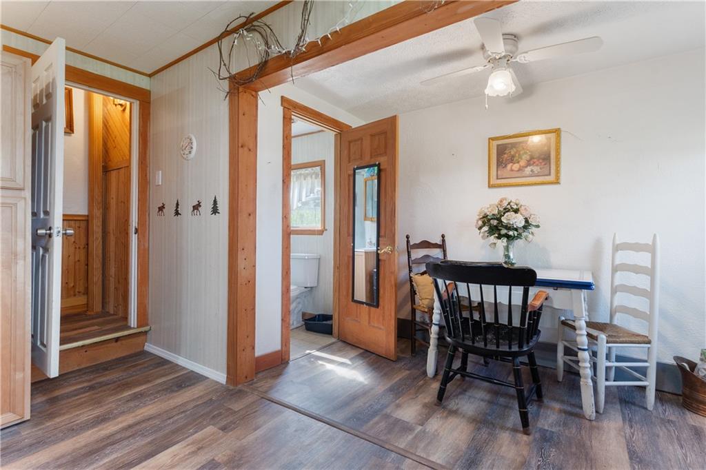 1878 Jefferson Road Rices Landing, PA 15357 - Photo 13 of 38 a view of a dining room with furniture window and wooden floor