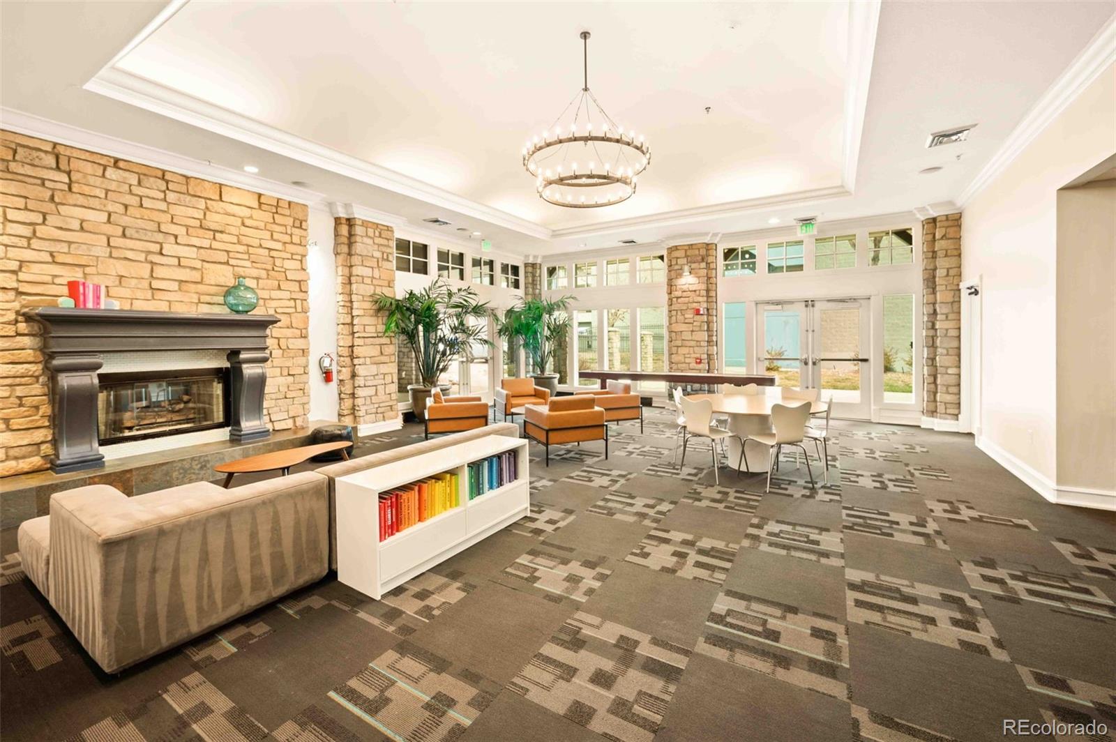 1150 Inca Street, Unit 39 Denver, CO 80204 - Photo 7 of 17 a very nice looking living room with a large window a rug and a fireplace