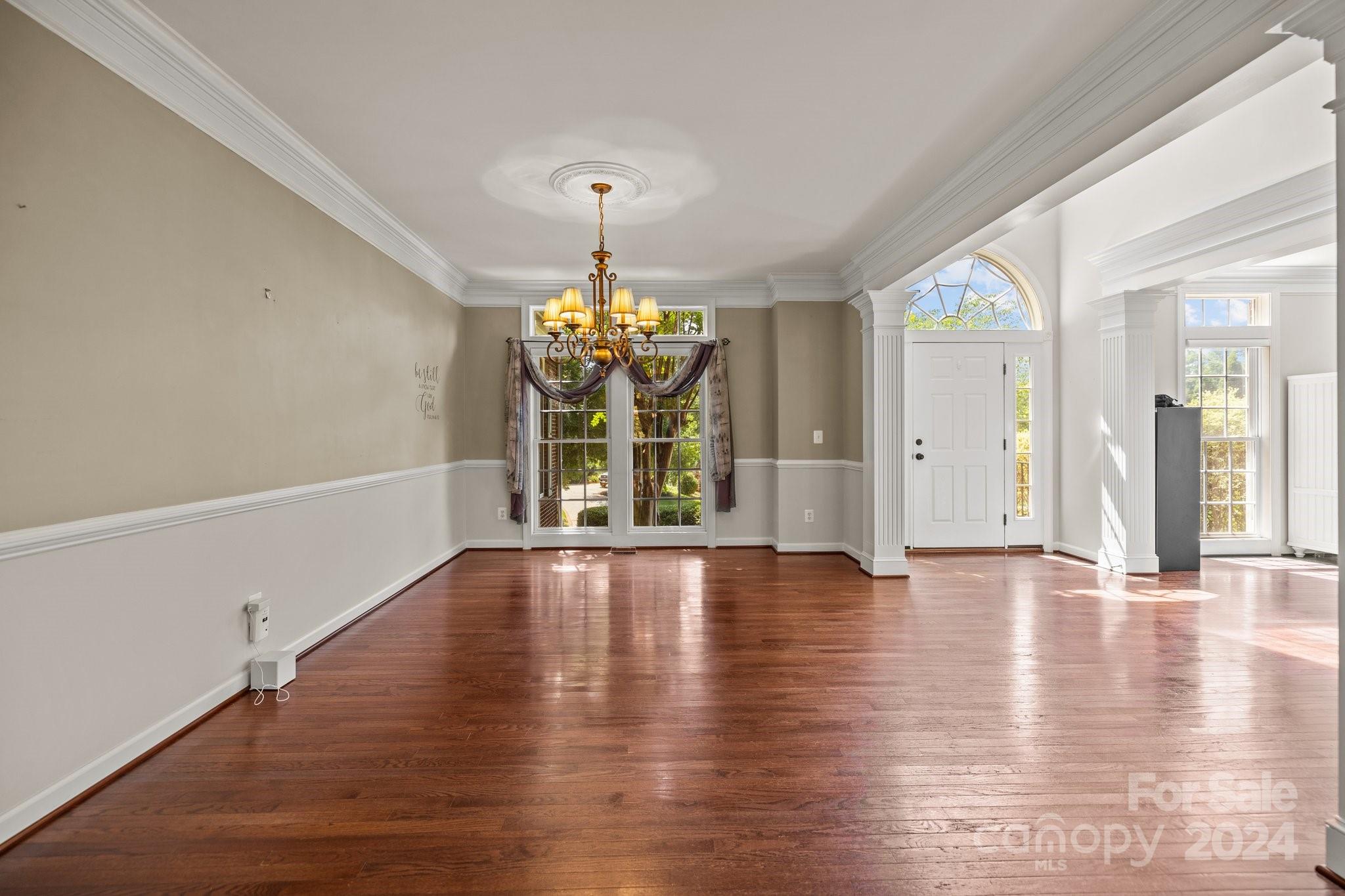 309 Chancelot Lane Fort Mill, SC 29708 - Photo 11 of 43 a view of an empty room with wooden floor and a window