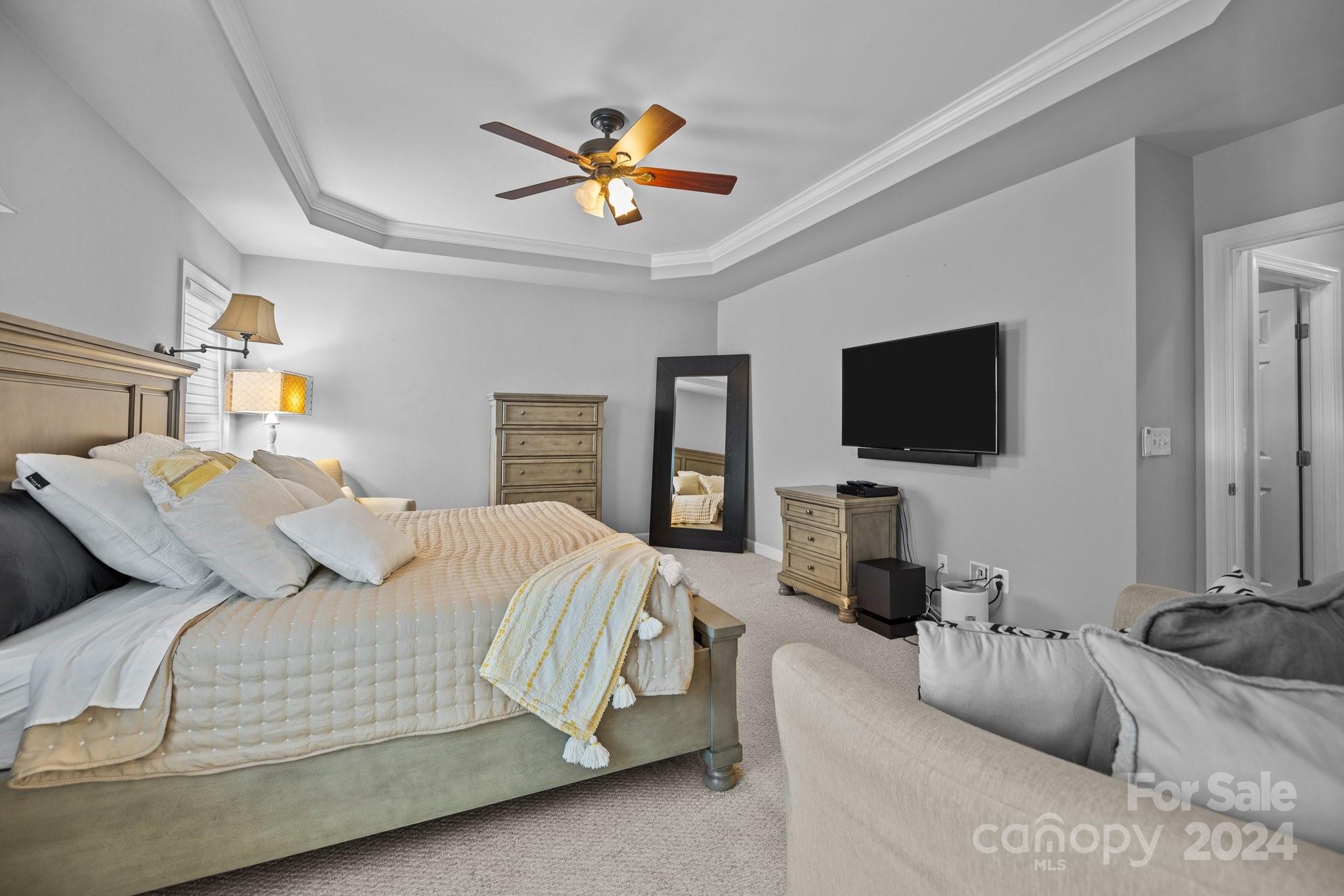 309 Chancelot Lane Fort Mill, SC 29708 - Photo 13 of 43 a bedroom with a large bed and a flat screen tv