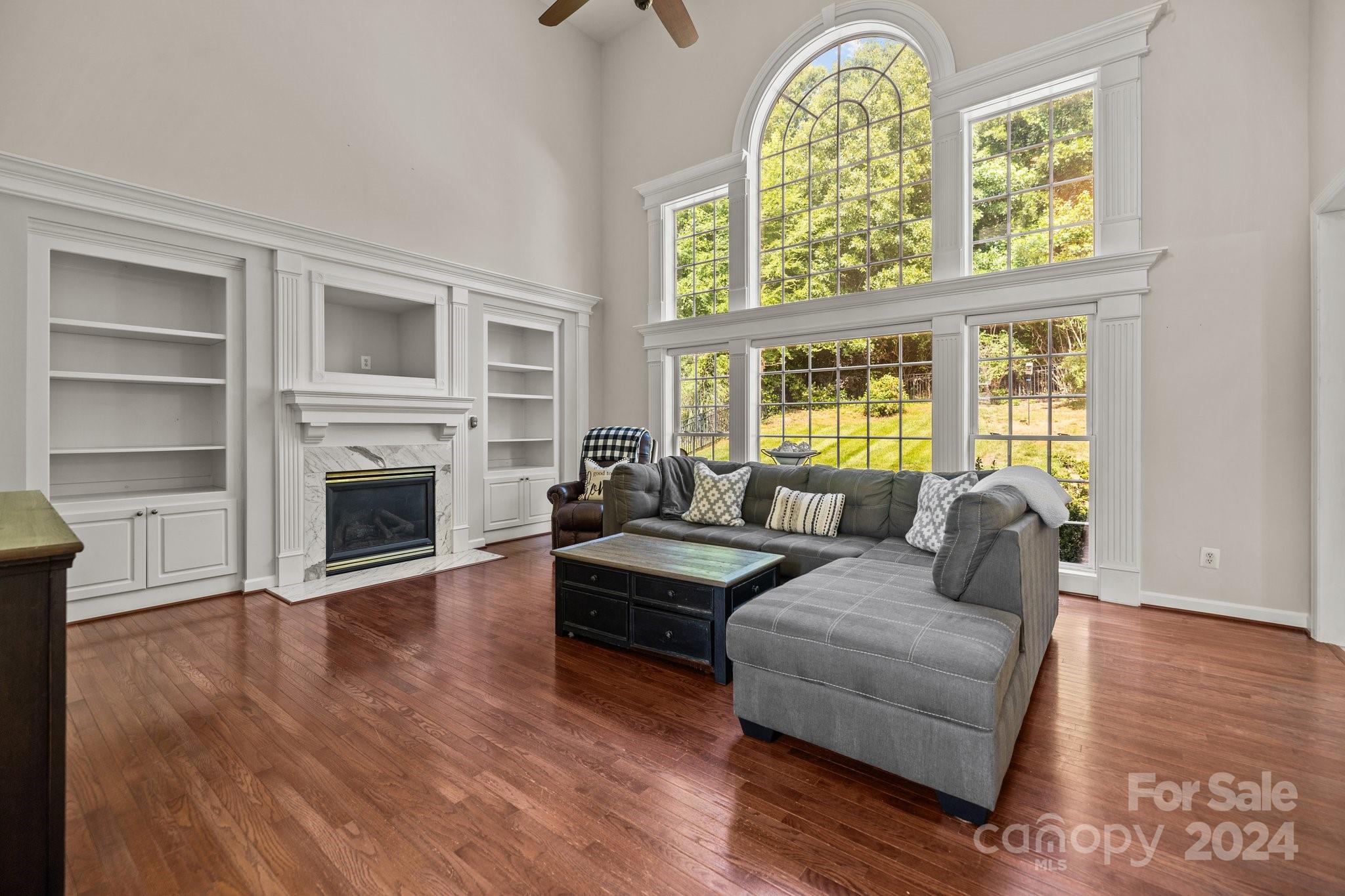 309 Chancelot Lane Fort Mill, SC 29708 - Photo 25 of 43 a living room with fireplace furniture and a wooden floor