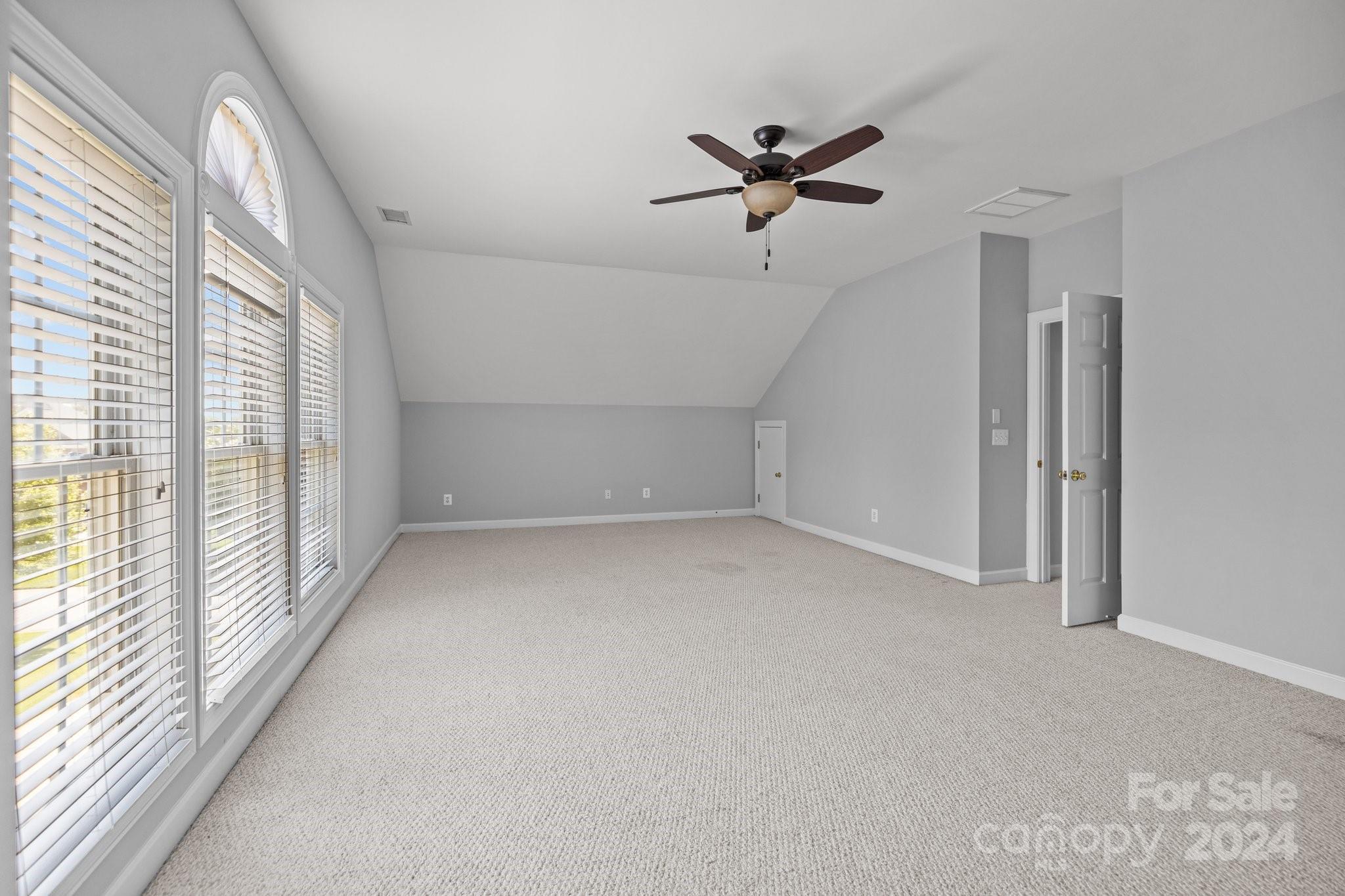 309 Chancelot Lane Fort Mill, SC 29708 - Photo 40 of 43 a view of a livingroom with a ceiling fan and window