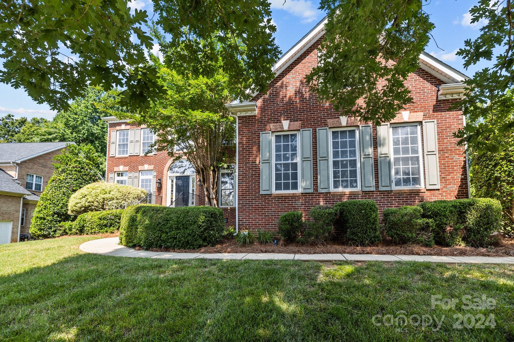 309 Chancelot Lane Fort Mill, SC 29708 - Photo 4 of 43 a front view of a house with garden
