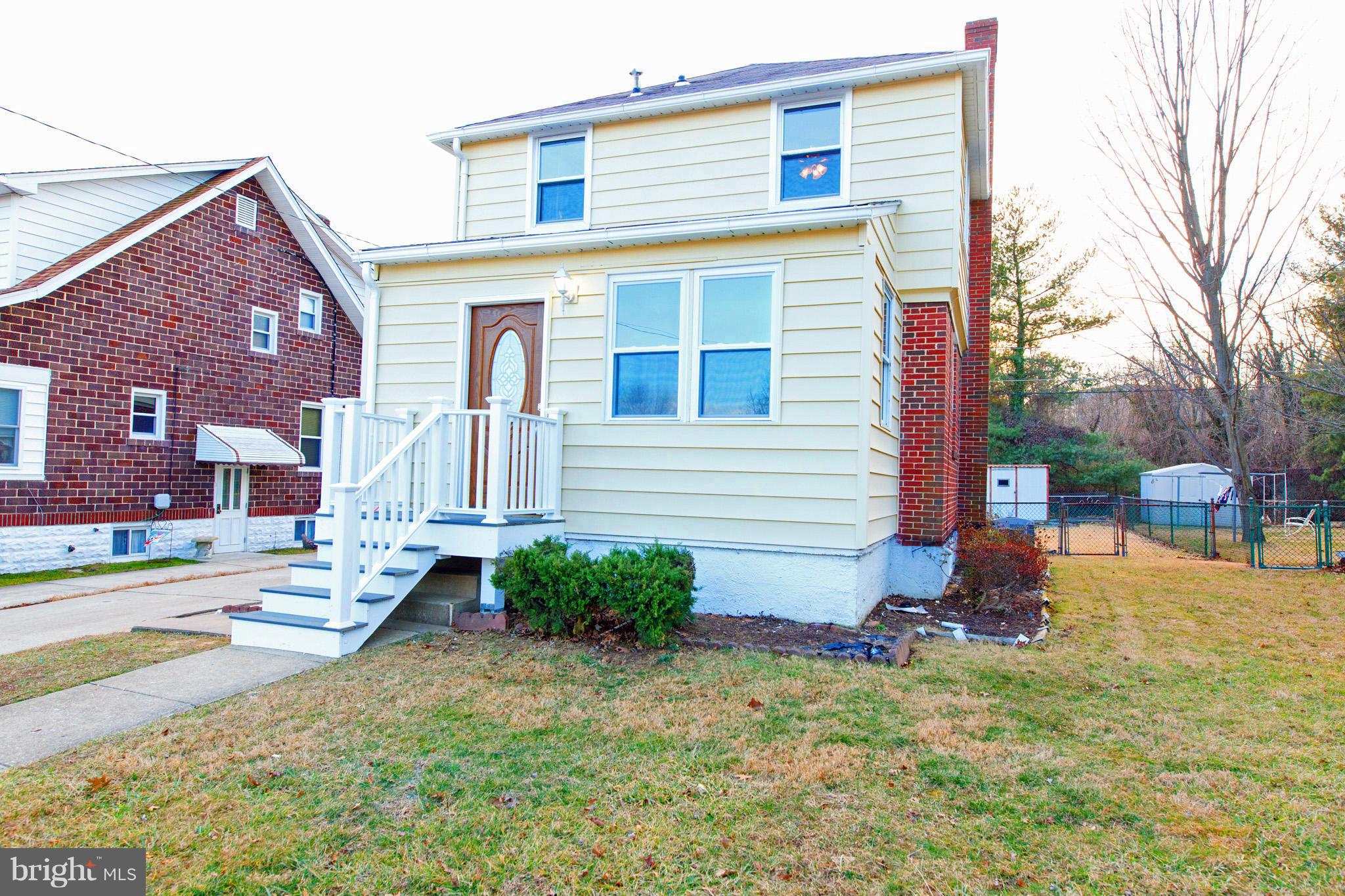 630 Warwick Road Baltimore, MD 21229 - Photo 2 of 23 a view of a house with a yard