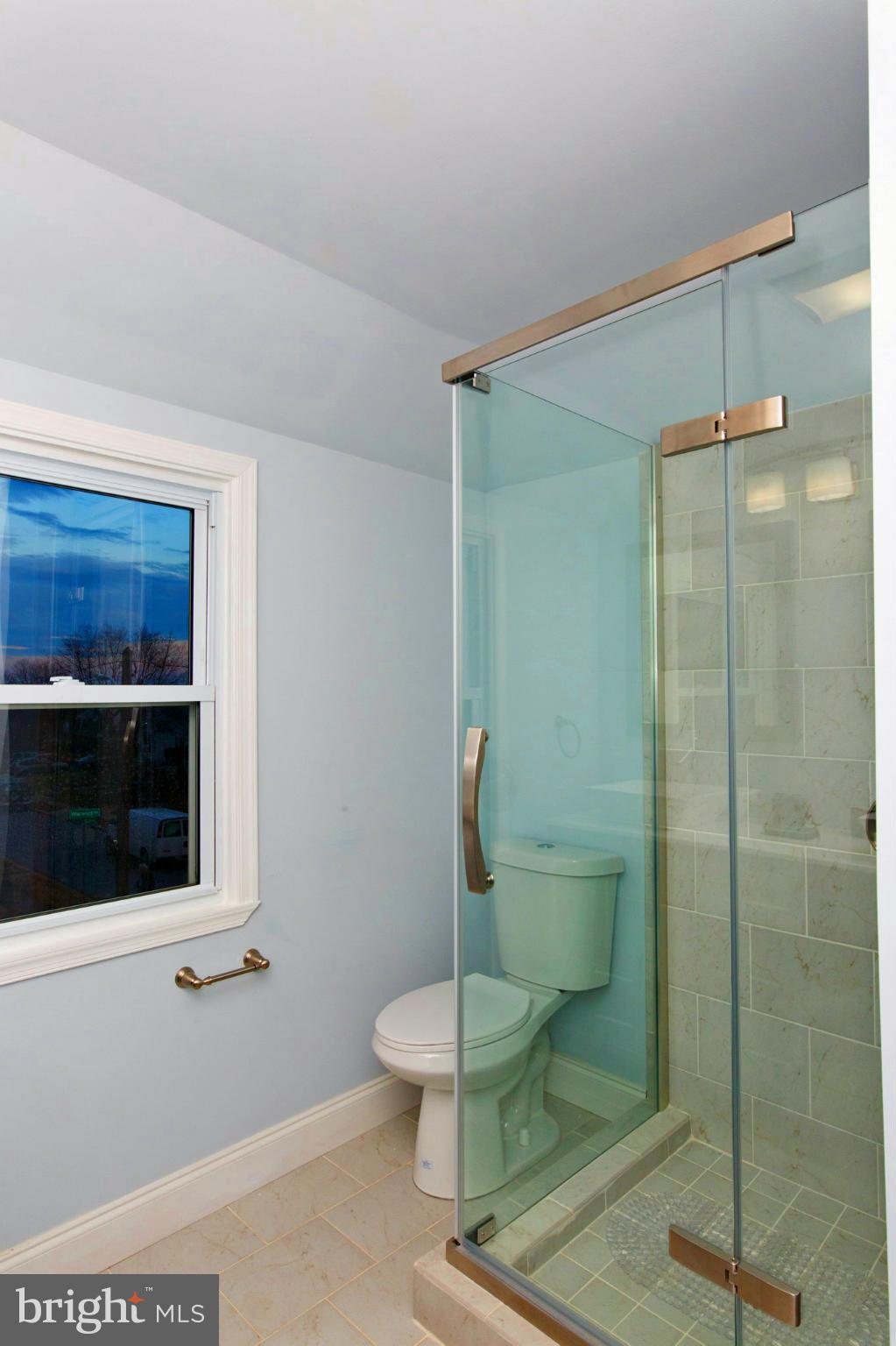 630 Warwick Road Baltimore, MD 21229 - Photo 13 of 23 a bathroom with a toilet and a shower