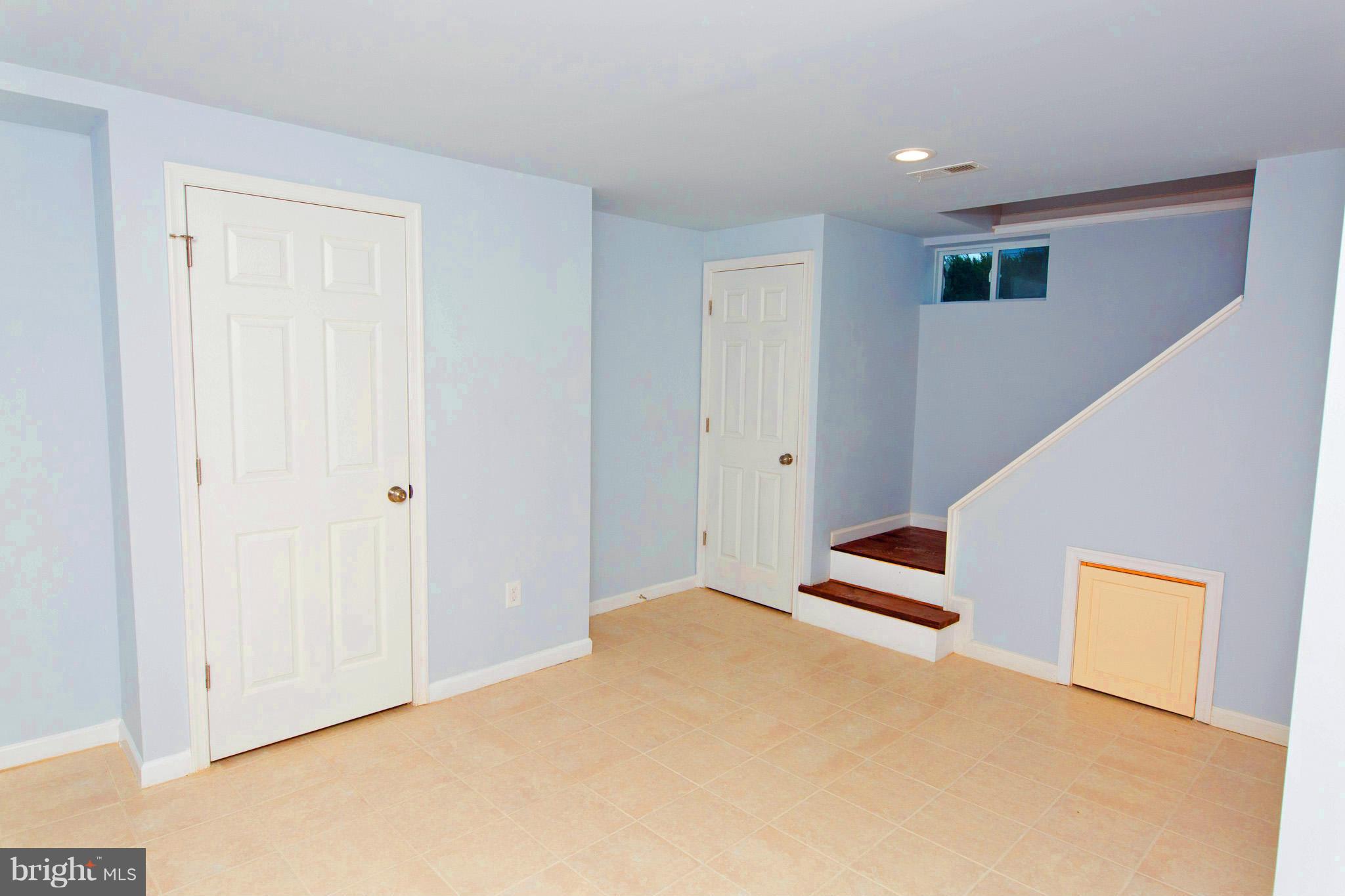 630 Warwick Road Baltimore, MD 21229 - Photo 17 of 23 a view of an empty room with wooden floor