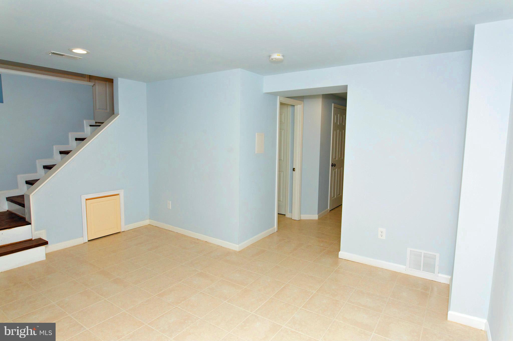 630 Warwick Road Baltimore, MD 21229 - Photo 18 of 23 a view of a big room with closet and windows