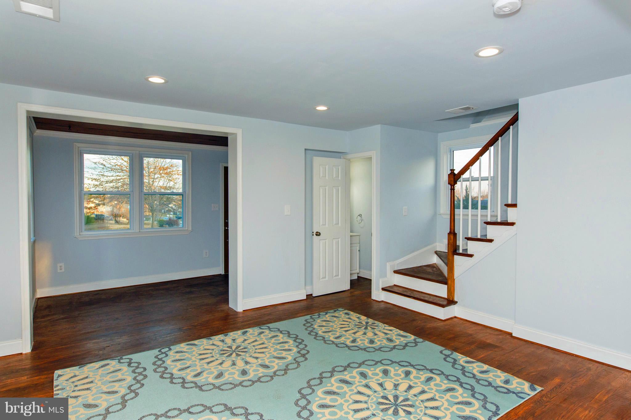 630 Warwick Road Baltimore, MD 21229 - Photo 3 of 23 a bedroom with wooden floor and a window