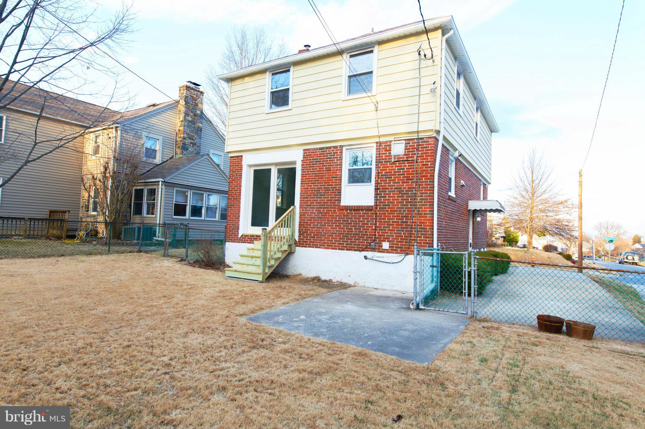 630 Warwick Road Baltimore, MD 21229 - Photo 22 of 23 a front view of a house with a yard