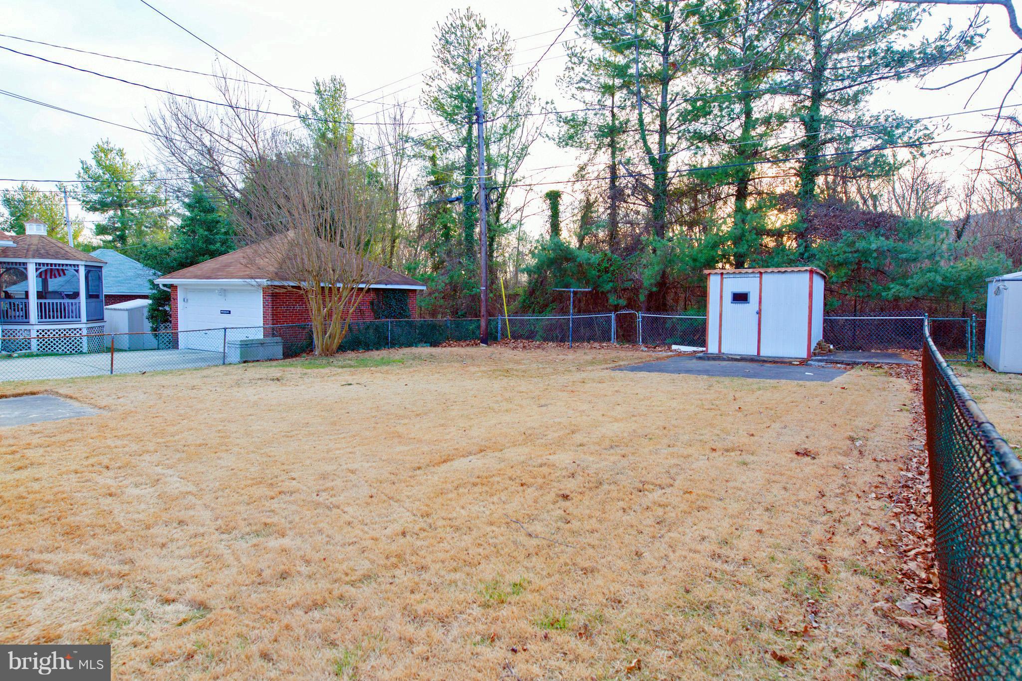 630 Warwick Road Baltimore, MD 21229 - Photo 23 of 23 a view of a house with a yard and garage