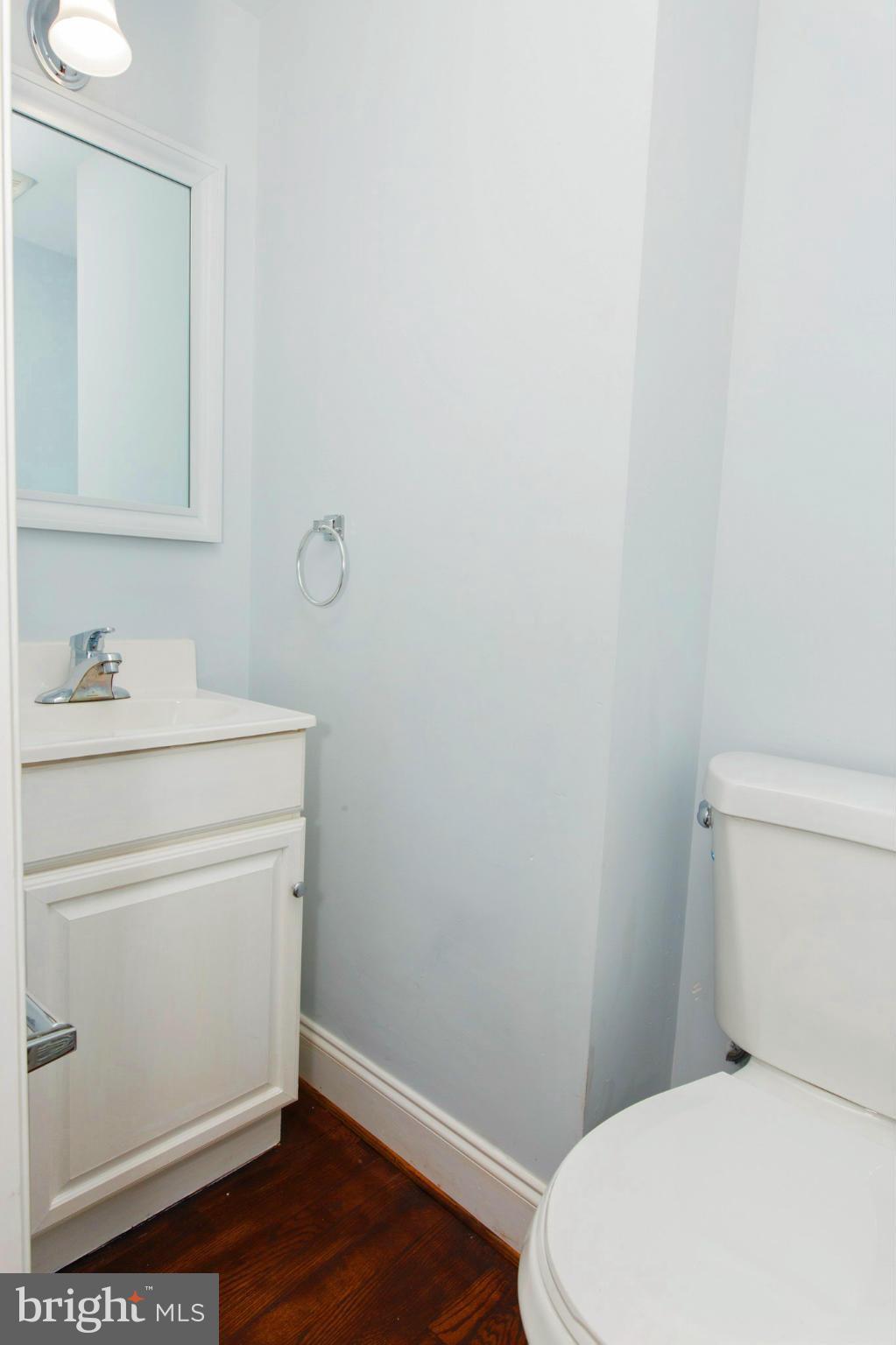 630 Warwick Road Baltimore, MD 21229 - Photo 4 of 23 a bathroom with a sink toilet and vanity