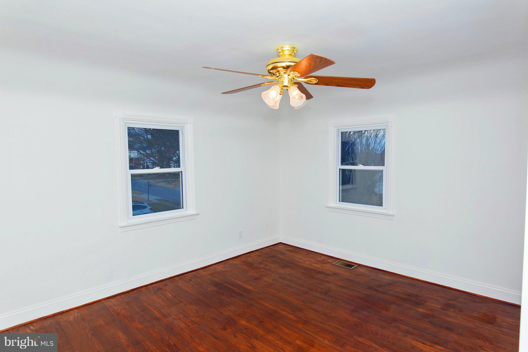 630 Warwick Road Baltimore, MD 21229 - Photo 9 of 23 a view of empty room with wooden floor