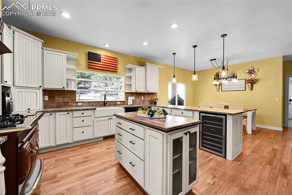 16540 Mesquite Road Peyton, CO 80831 - Photo 18 of 50 a kitchen with stainless steel appliances granite countertop a stove a sink dishwasher and a refrigerator