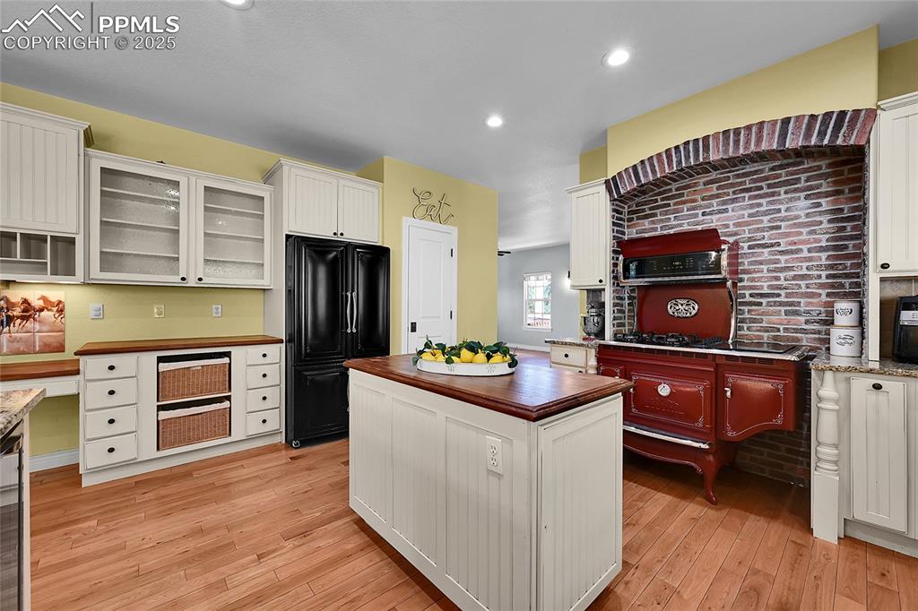 16540 Mesquite Road Peyton, CO 80831 - Photo 20 of 50 a kitchen with stainless steel appliances a stove refrigerator and microwave
