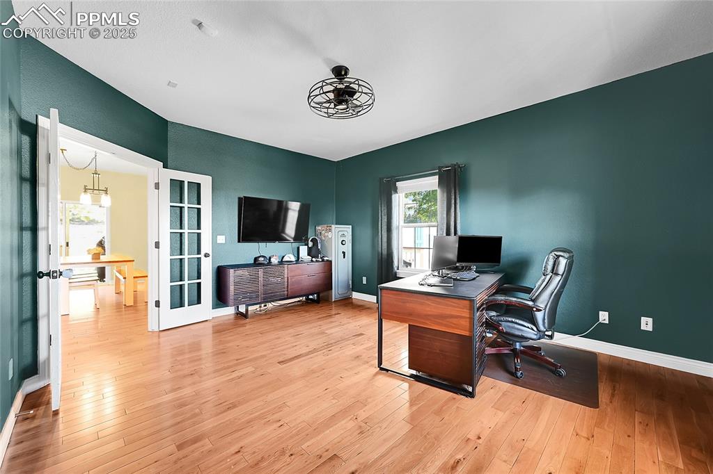 16540 Mesquite Road Peyton, CO 80831 - Photo 23 of 50 a view of a livingroom with workspace and a window