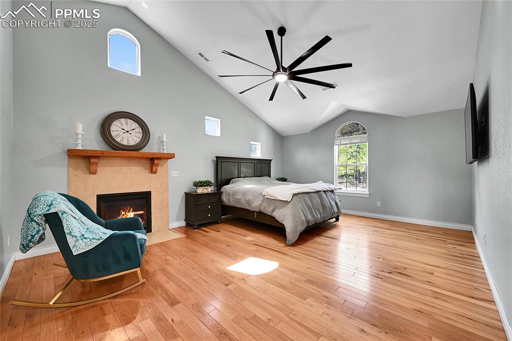 16540 Mesquite Road Peyton, CO 80831 - Photo 25 of 50 a bedroom with a bed and a fireplace