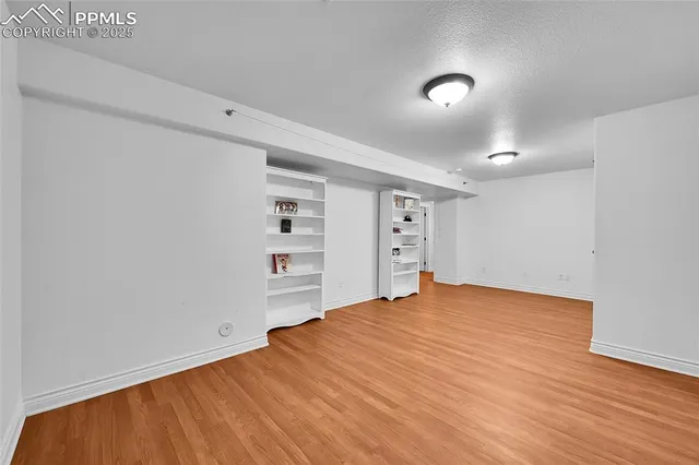 a bedroom with a large bed and a dresser