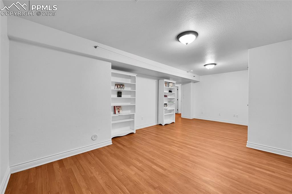 16540 Mesquite Road Peyton, CO 80831 - Photo 35 of 50 a view of empty room with wooden floor