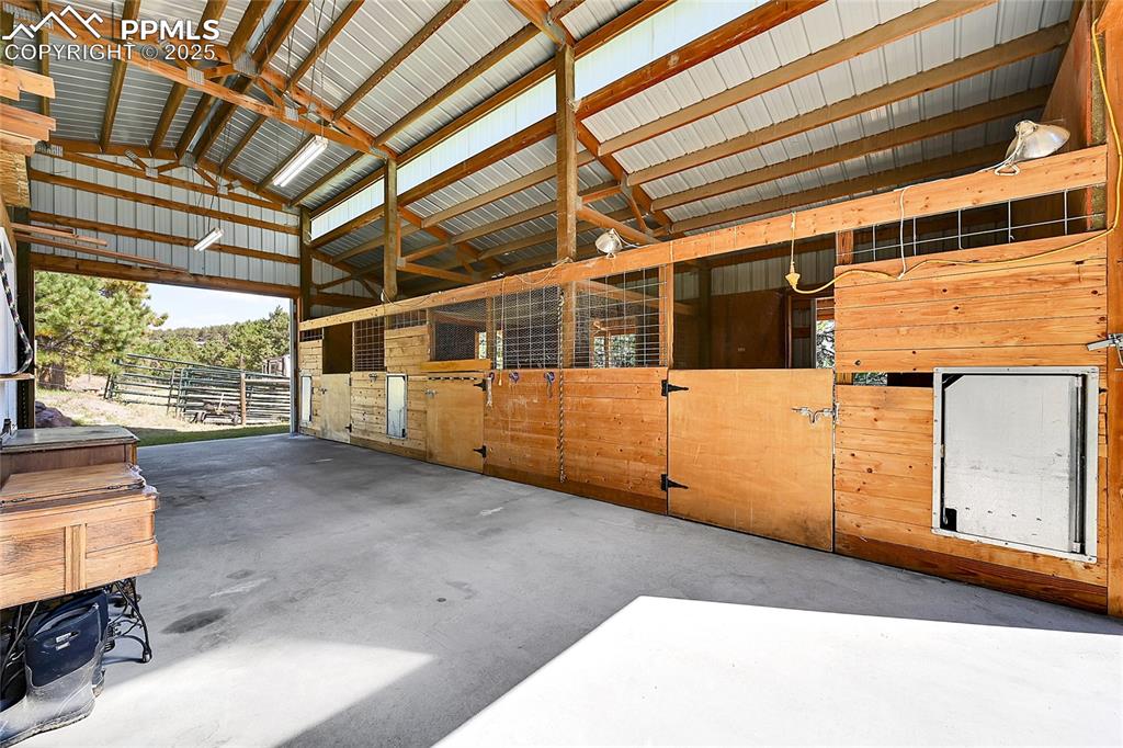 16540 Mesquite Road Peyton, CO 80831 - Photo 45 of 50 a view of a large room with wooden walls