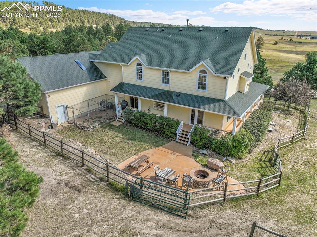 16540 Mesquite Road Peyton, CO 80831 - Photo 5 of 50 an aerial view of a house with a yard