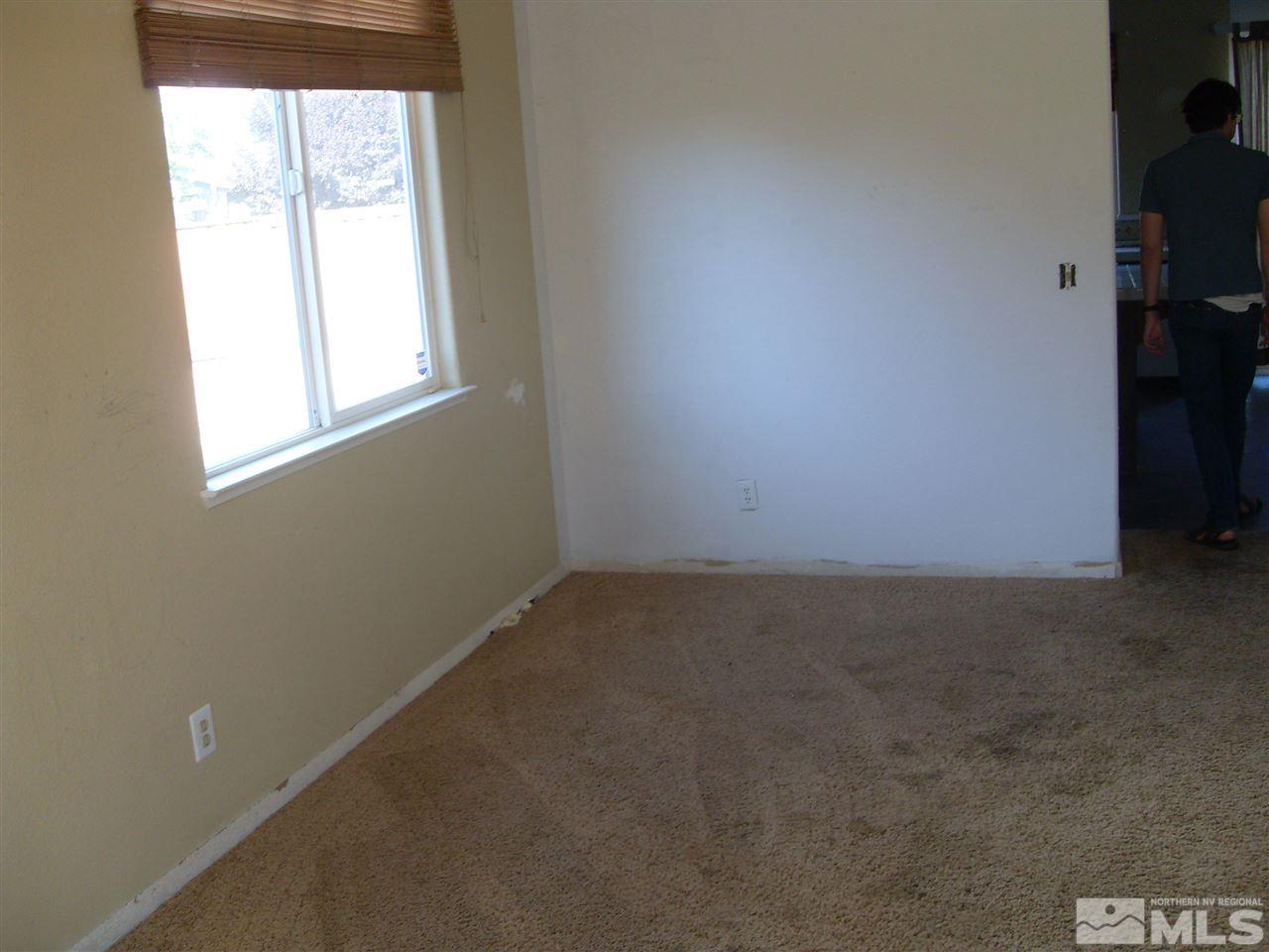 11330 Crotone Way Reno, NV 89521 - Photo 8 of 17 an empty room with a window