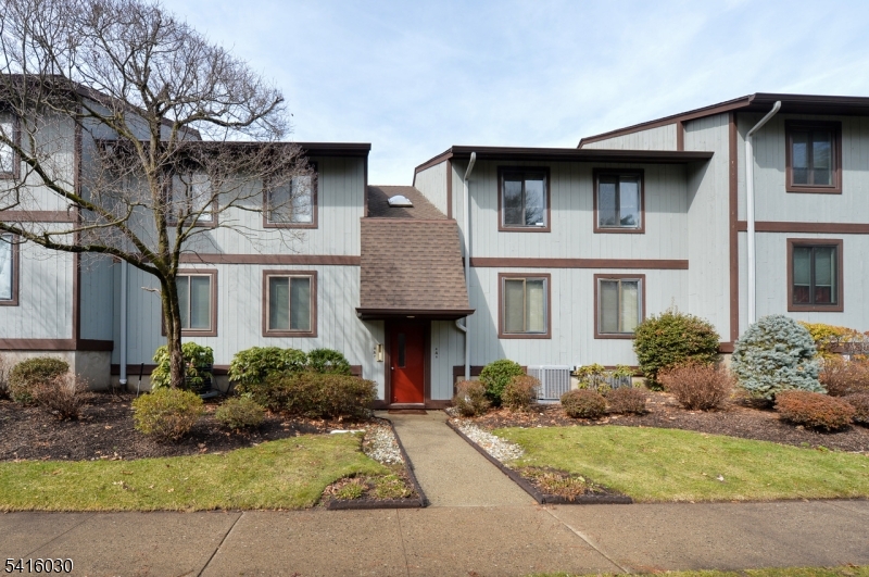 50 Rock Road, Unit 7A Hawthorne, NJ 07506 - Photo 14 of 17 a front view of a house with a yard garage and outdoor seating