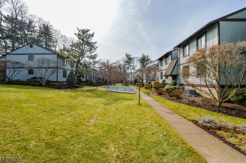 50 Rock Road, Unit 7A Hawthorne, NJ 07506 - Photo 15 of 17 a view of a swimming pool with an outdoor seating