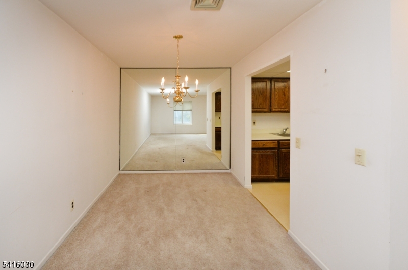 50 Rock Road, Unit 7A Hawthorne, NJ 07506 - Photo 3 of 17 en empty room with kitchen and sink