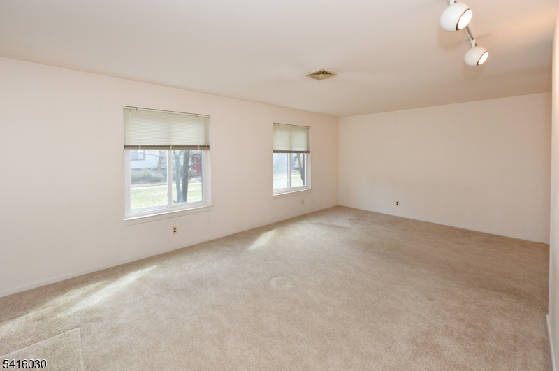 50 Rock Road, Unit 7A Hawthorne, NJ 07506 - Photo 9 of 17 an empty room with windows and closet