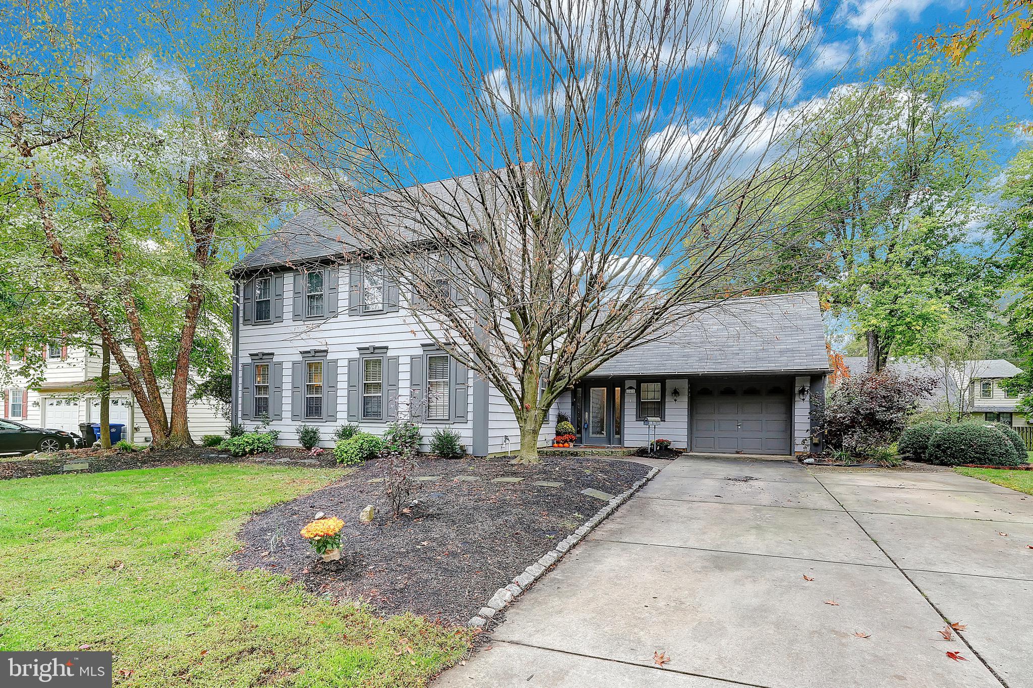 143 Whitemarsh Way Delran, NJ 08075 - Photo 2 of 33 a front view of a house with a garden and trees