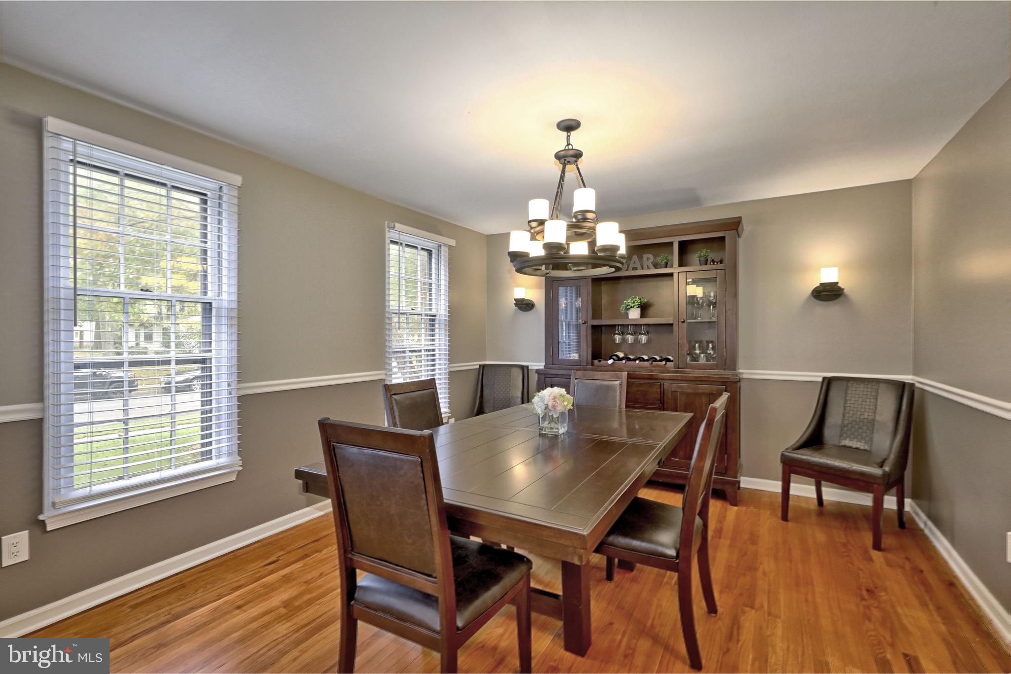 143 Whitemarsh Way Delran, NJ 08075 - Photo 11 of 33 a view of a dining room with furniture a chandelier and wooden floor