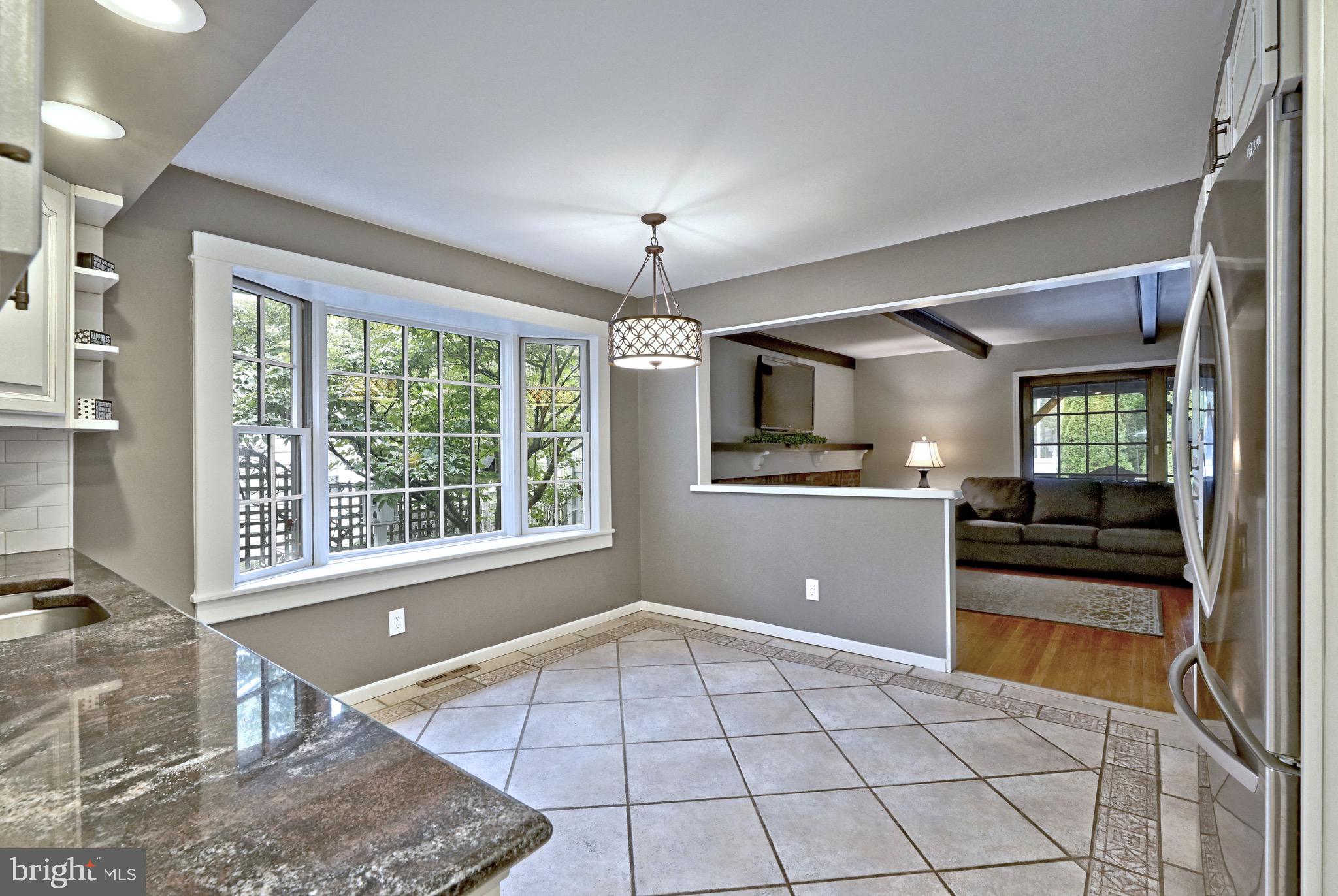 143 Whitemarsh Way Delran, NJ 08075 - Photo 13 of 33 a view of a kitchen with a stove cabinets and a floor to ceiling window