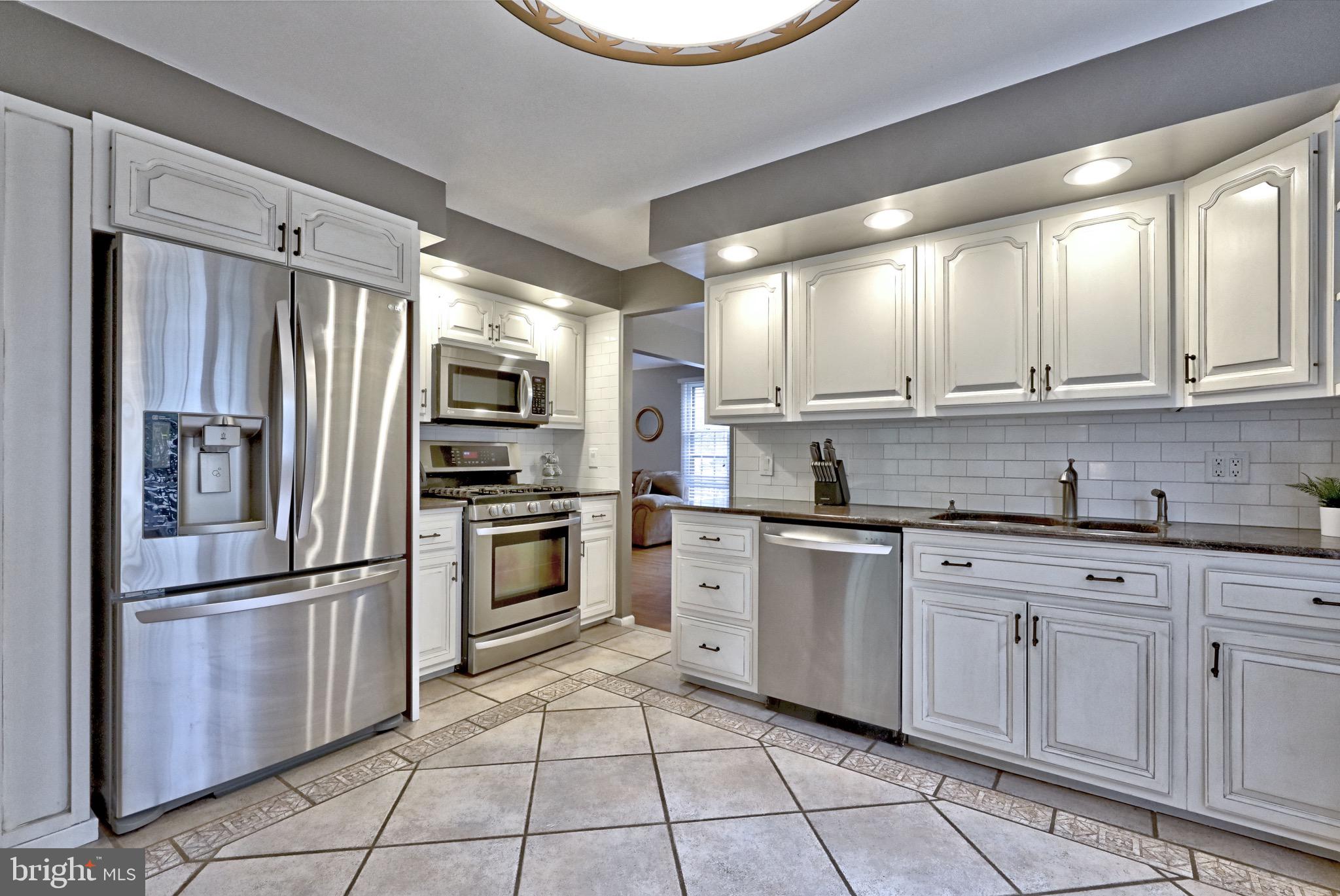 143 Whitemarsh Way Delran, NJ 08075 - Photo 15 of 33 a kitchen with cabinets stainless steel appliances and a window